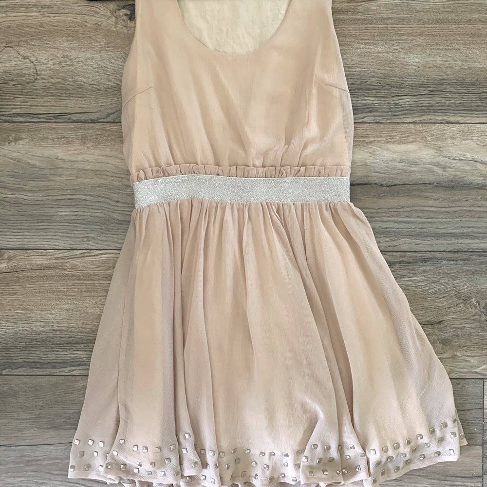 Lucca couture bone colored dress.